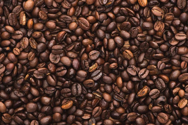 Top view of fresh roasted coffee beans background — Stock Photo