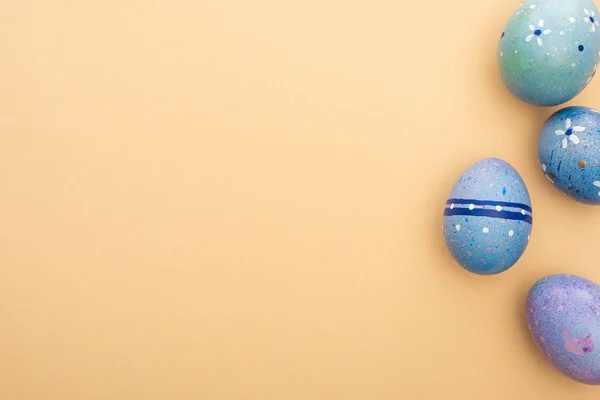 Top view of blue easter eggs on beige background — Stock Photo