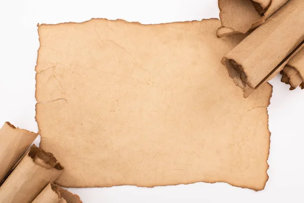 Top view of vintage blank and rolled paper isolated on white — Stock Photo