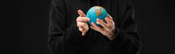 Panoramic view of woman holding plasticine globe isolated on black, global warming concept — Stock Photo