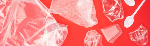 Panoramic view of plastic garbage isolated on red, global warming concept — Stock Photo