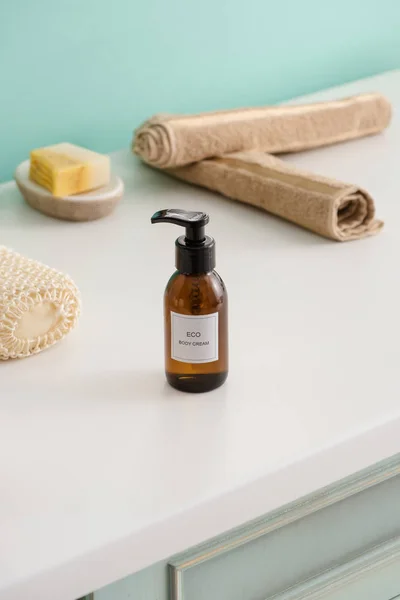 Selective focus of hygiene objects with bottle of eco body cream in bathroom, zero waste concept — Stock Photo