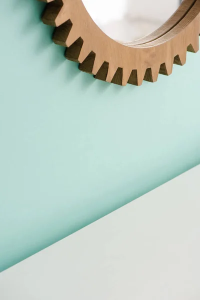 Round mirror in wooden frame on turquoise wall in bathroom, zero waste concept — Stock Photo