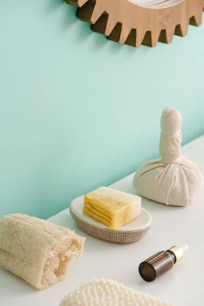 Selective focus of loofah, bottle of cosmetic oil, soap and thai herbal compress ball in bathroom, zero waste concept — Stock Photo