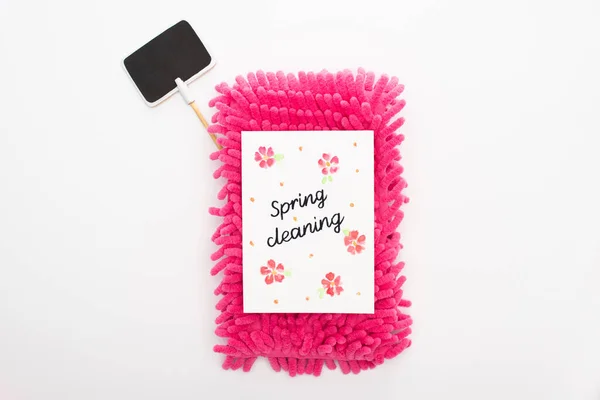 Top view of pink sponge and spring cleaning card near blank sign on white background — Stock Photo