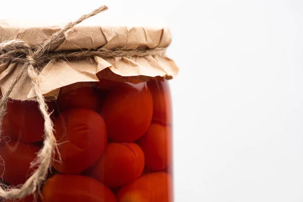 Close up view of homemade tasty canned tomatoes in jar isolated on white — Stock Photo