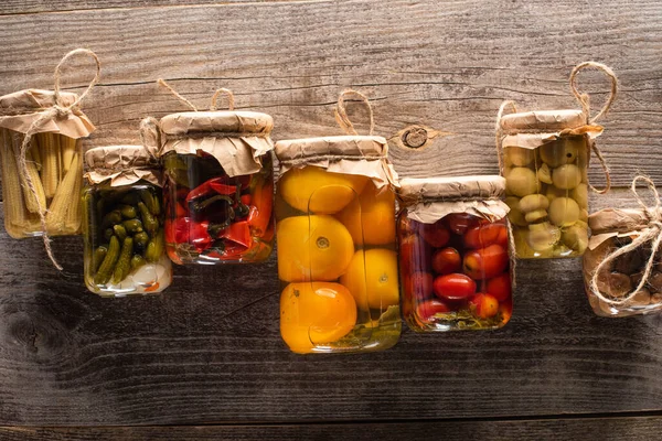 Top view of delicious homemade tasty pickles on wooden rustic table — Stock Photo