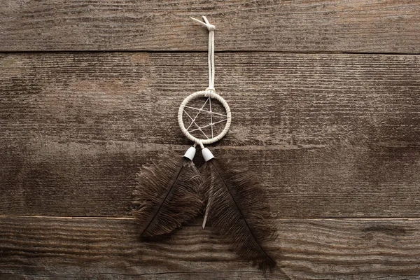 Top view of shamanic dreamcatcher on wooden background — Stock Photo