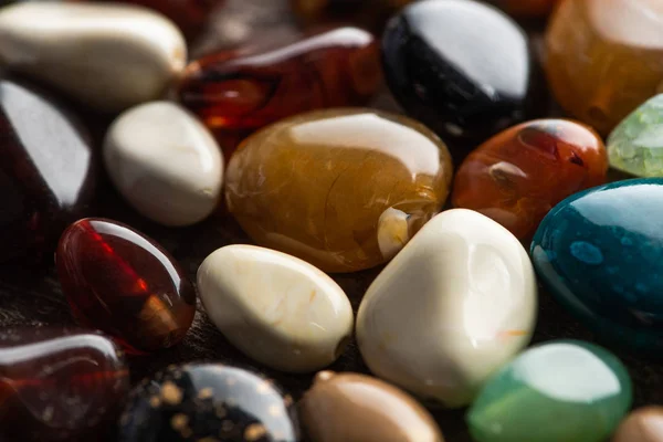 Close up view of fortune telling stones on wooden background — Stock Photo