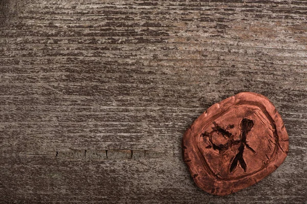 Top view of clay shamanic amulet on wooden background — Stock Photo