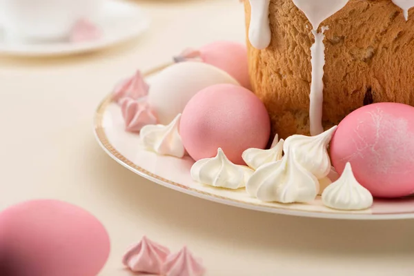 Close up view of Easter cake with painted eggs and meringue on plate — Stock Photo