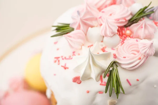 Close up view of tasty Easter cake with rosemary and meringue on glaze — Stock Photo