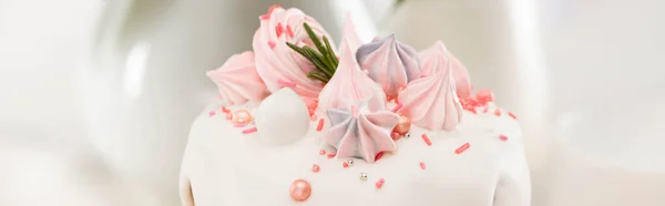 Close up view of delicious Easter cake with white glaze and meringue, panoramic shot — Stock Photo