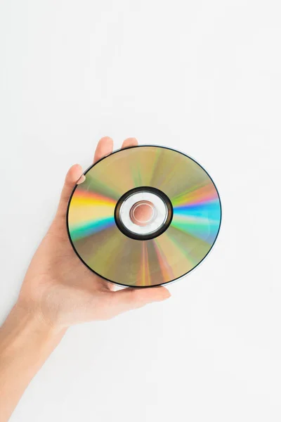 Visão parcial do homem segurando disco de CD no fundo branco — Fotografia de Stock