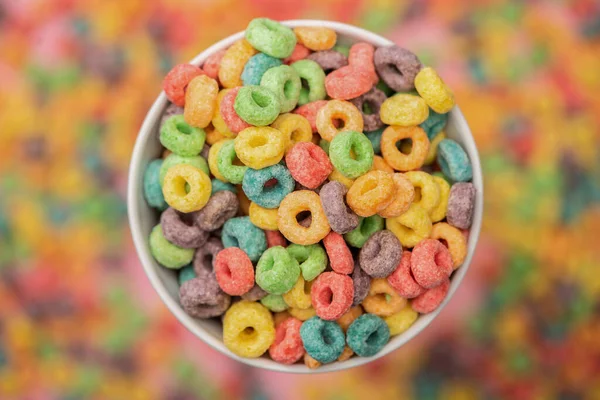 Selective focus of bright colorful breakfast cereal in bowl — Stock Photo