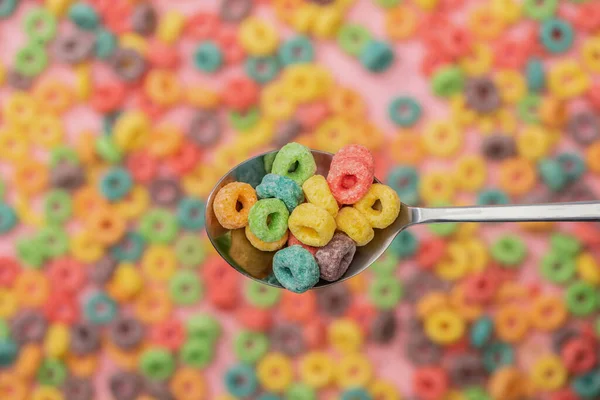 Selective focus of bright colorful breakfast cereal in spoon — Stock Photo