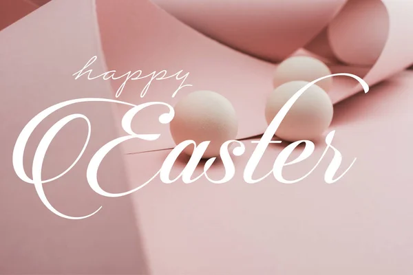 Chicken eggs in spiral paper pink swirls with happy Easter illustration — Stock Photo