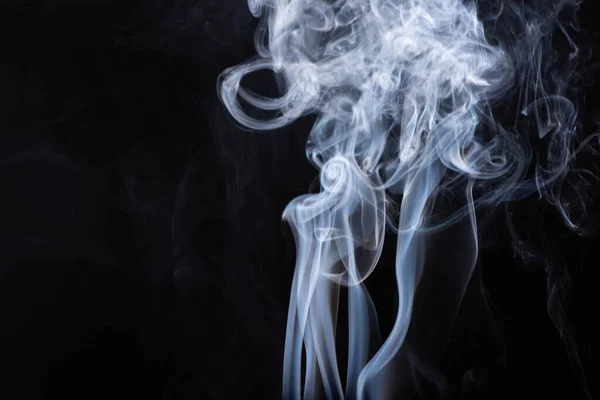 Abstract white flowing smoke clouds on black background — Stock Photo