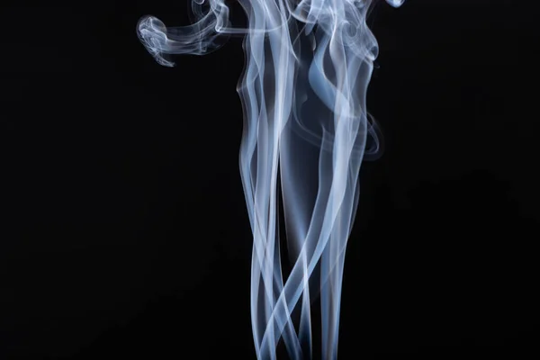 Abstract white flowing smoke on black background — Stock Photo