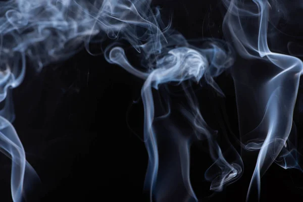 White flowing smoke cloud on black background — Stock Photo