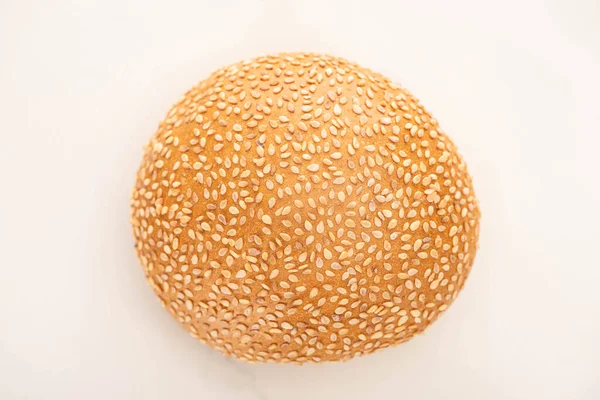 Top view of fresh bun with sesame on white background — Stock Photo