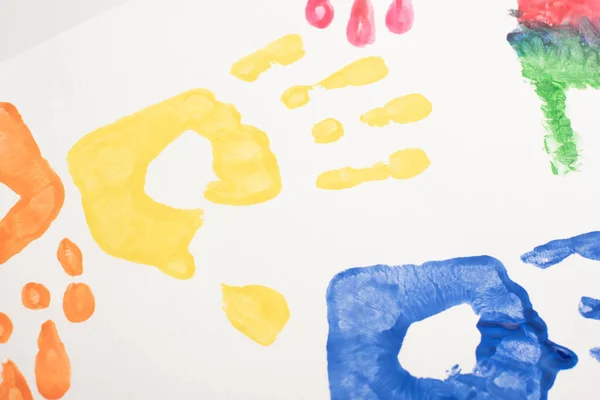 Top view of colorful handprints on white for World Autism Awareness Day — Stock Photo