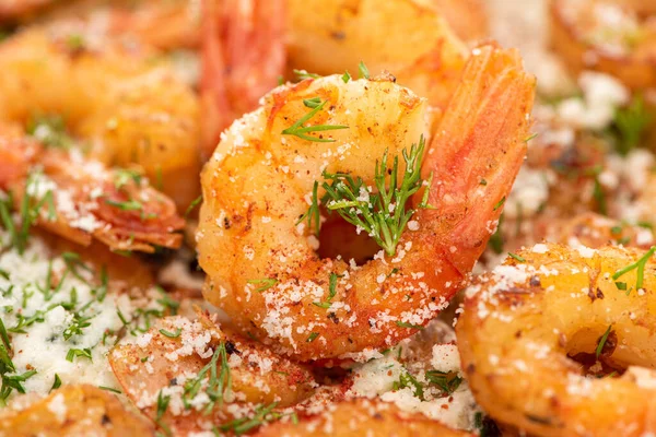 Close up view of fried shrimps with dill and grated cheese — Stock Photo