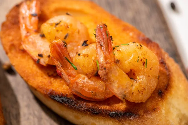 Close up view of canape with toast bread and fried shrimps — Stock Photo