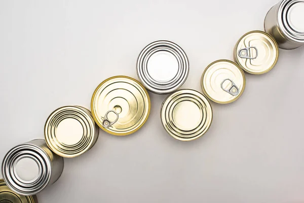 Top view of cans with canned food on white background, food donation concept — Stock Photo