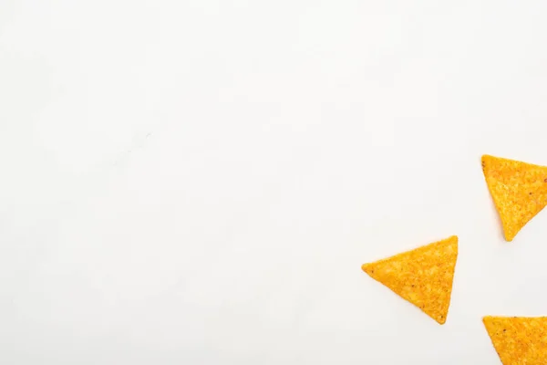 Top view of corn nachos on white background — Stock Photo