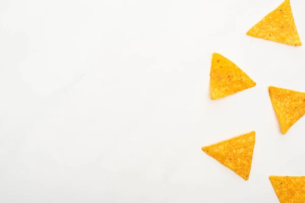 Top view of corn nachos on white background — Stock Photo