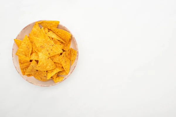 Top view of corn nachos on white background — Stock Photo