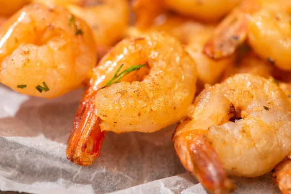 Close up view of crispy prawns on parchment paper — Stock Photo