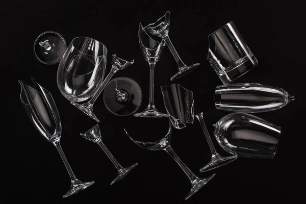 Top view of broken sharp transparent glasses isolated on black — Stock Photo