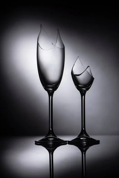 Broken sharp transparent glasses in dark — Stock Photo