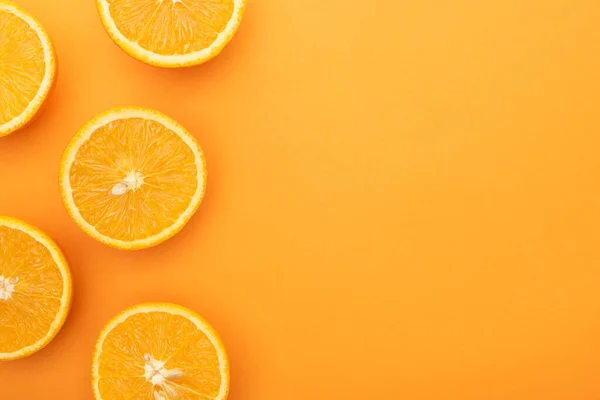 Top view of ripe juicy orange slices on colorful background with copy space — Stock Photo