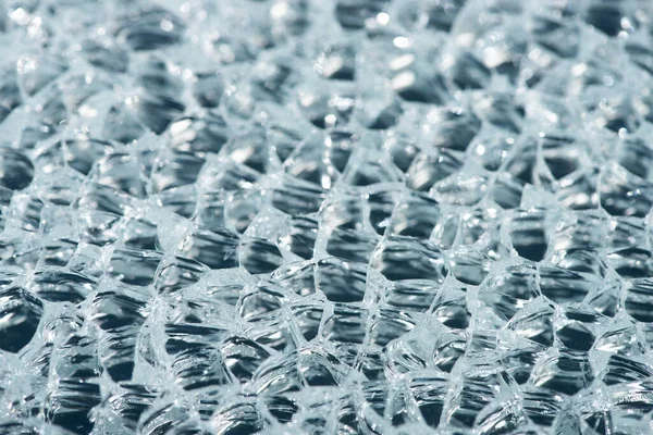 Close up view of abstract transparent ice textured background — Stock Photo