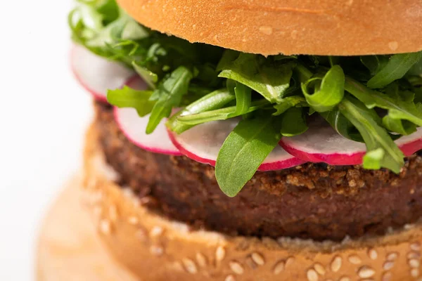 Close up view of delicious vegan burger with radish and arugula on white background — Stock Photo