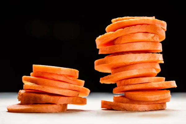 Close up view of fresh ripe carrot slices isolated on black — Stock Photo