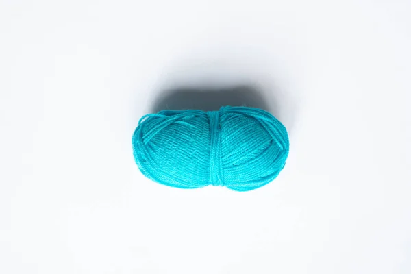 Top view of blue wool yarn on white background — Stock Photo