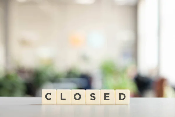 White cubes with closed lettering on white surface — Stock Photo