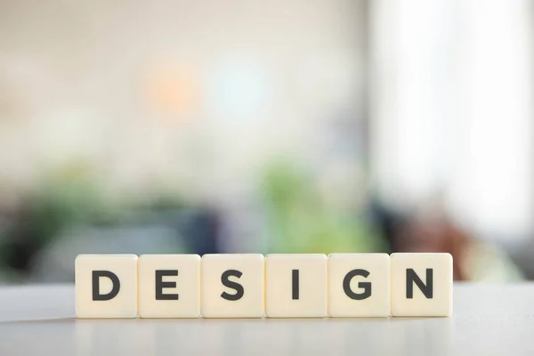 White cubes with design inscription on office desk — Stock Photo