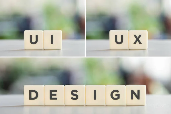 Collage of white blocks with ui, ux, design lettering on office desk. - foto de stock