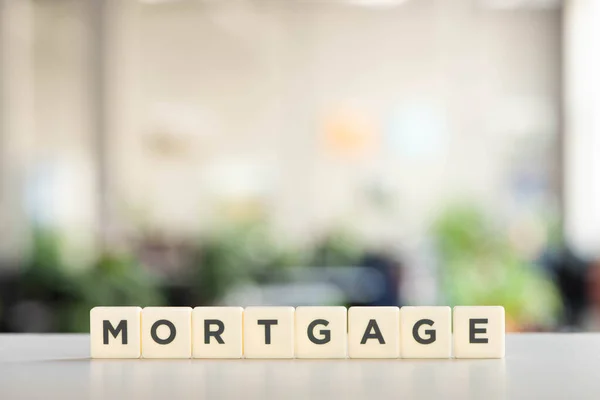 White blocks with mortgage inscription on white surface — Stock Photo