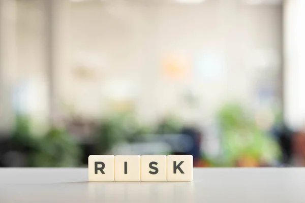 White blocks with risk inscription on white surface — Stock Photo