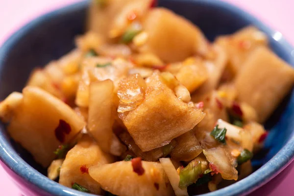 Close up of traditional korean dish with braised potatoes in bowl — Stock Photo