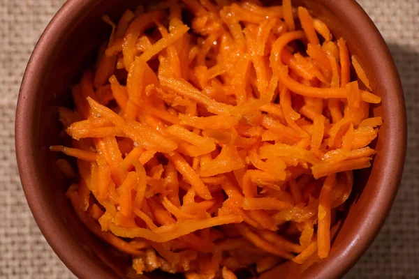 Top view of orange and tasty carrot in bowl — Stock Photo