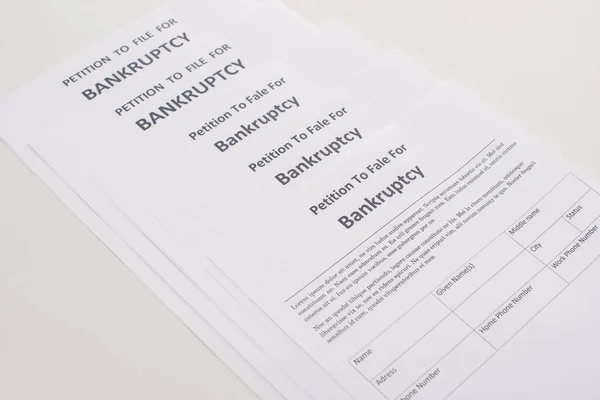 Bankruptcy petition papers on white background — Stock Photo