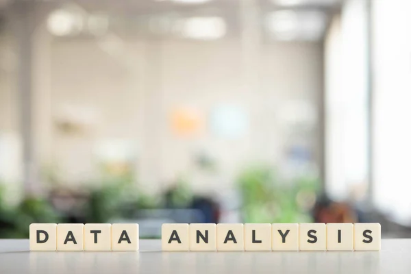 White cubes with data analysis inscription on white surface — Stock Photo