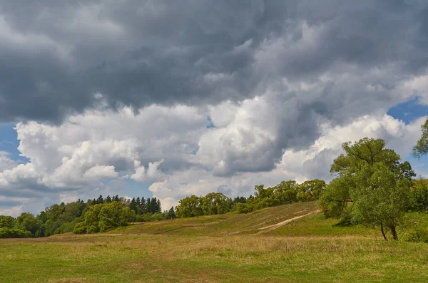 Landscape with thunder clouds sky